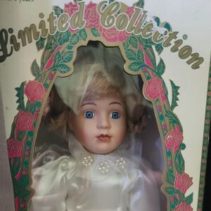 Porcelain Doll with White Dress and Blue Eyes